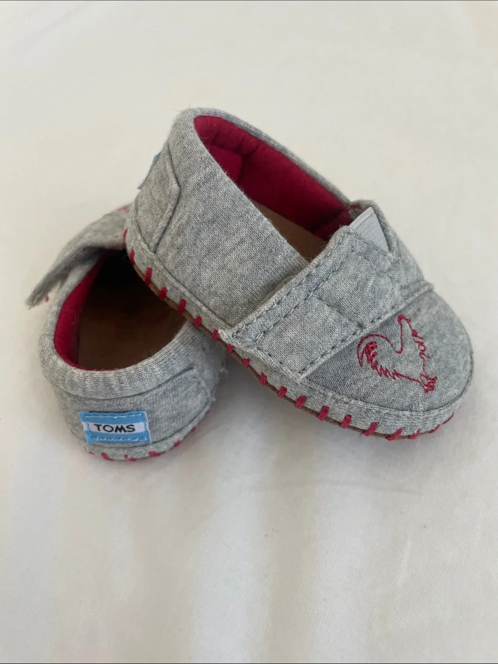 Toms Grey Slip-On Baby Shoes with Red Accents and Rooster Stitch (NWOT) size 2